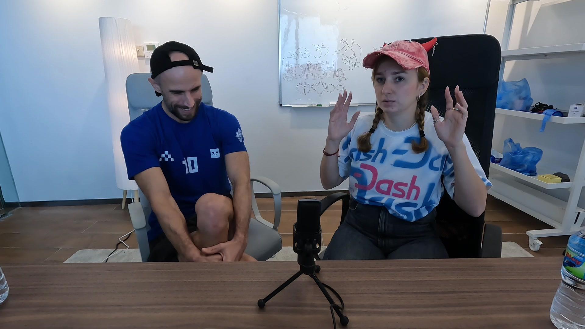 Daria Chernozub speaking animatedly with both hands raised