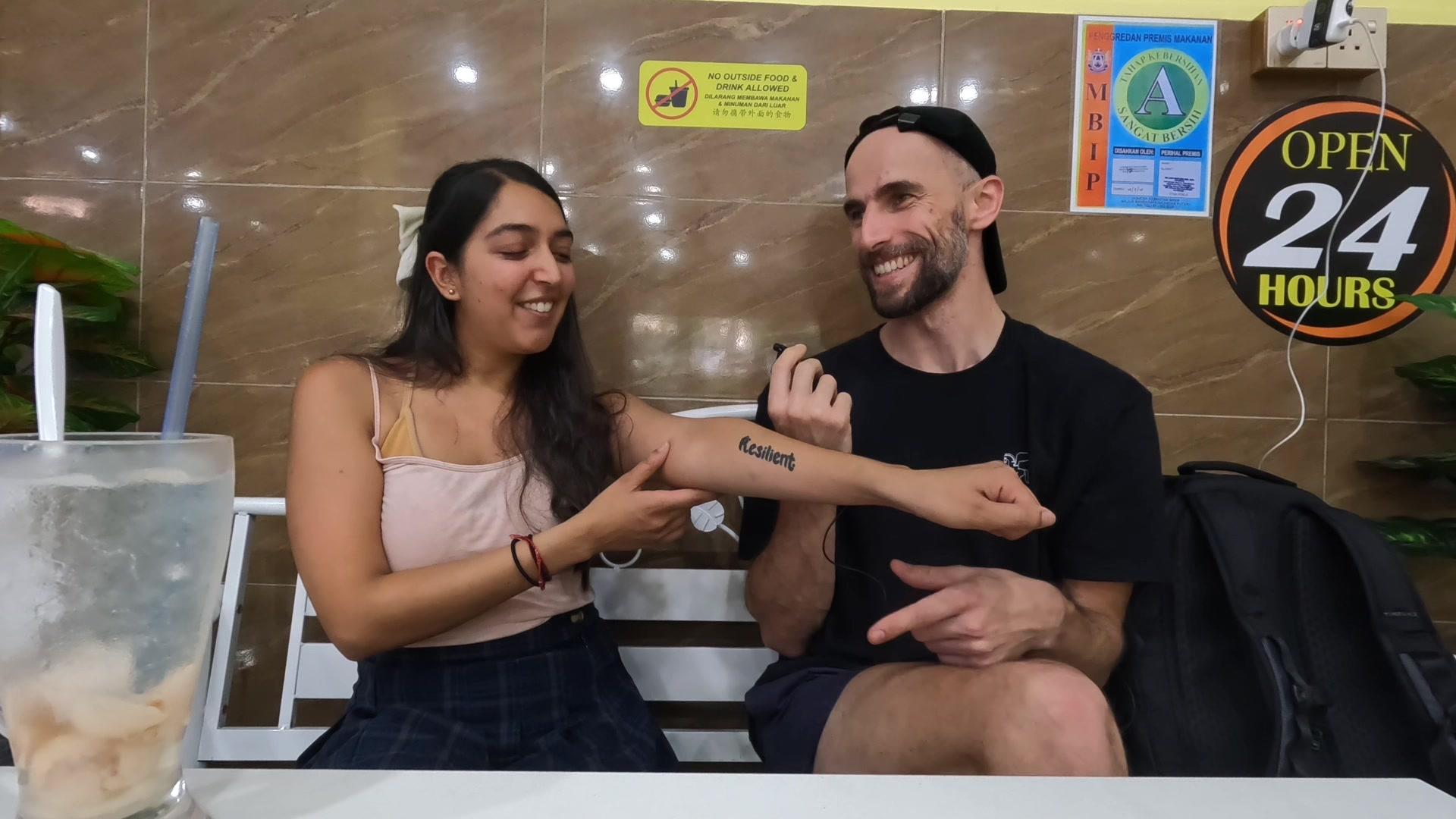 Velveteen showing the resilience tattoo on her hand during the conversation